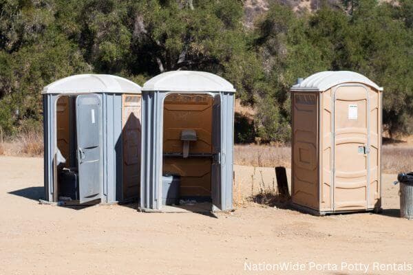 a clean row of portable restrooms for outdoor weddings or festivals in Roach, MO